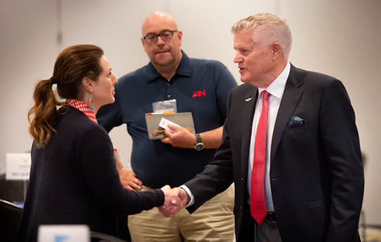 Greteman Group Vice President Ashley Bowen Cook chats with Dempsey, who formerly worked in Wichita for Cessna.
