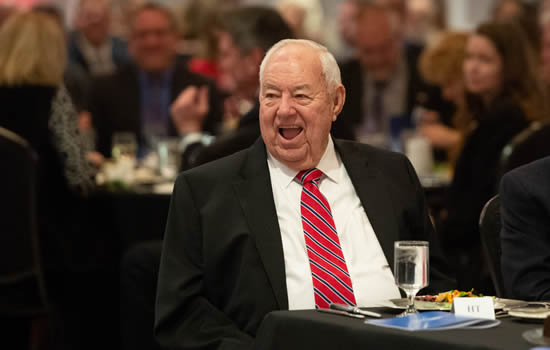 Clay Lacy laughs at the Wichita Aero Club gala as he’s remembered for his nearly endless contributions to the aviation industry