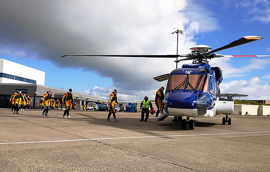 Passengers embark a Babcock S-92 helicopter in Sumburgh.