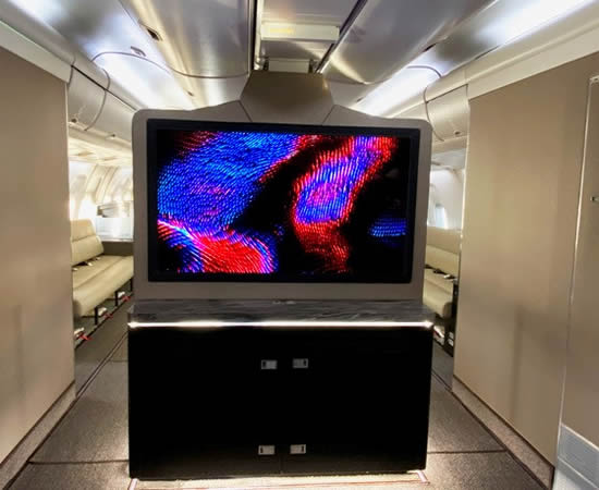 SmartCanvas 55" OLED UHD 4K cab display shown here installed on a Boeing 767.