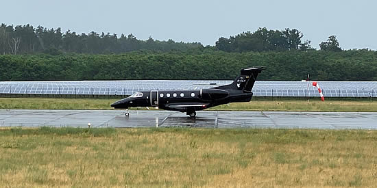 The runway at Berlin Neuhardenberg Airport is flanked by th solar farm.