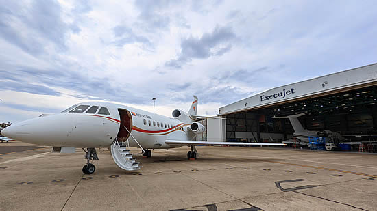 Air Niugini Falcon 900 VIP aircraft in front of ExecuJet MRO Services hangar in Sydney.
