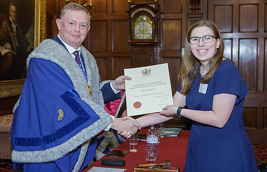 Elise Hammond accepts her Air bp Sterling Pilot Scholarship Award from Nick Goodwyn, Immediate Past Master, the Honourable Company of Air Pilots | photo: www.sharpphoto.co.uk