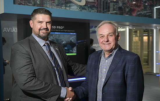 Dave Falberg, VP International, Satcom Direct (left) and Tracy Trent, CEO of Stellar Blu, mark the new agreement at MEBAA 2022.