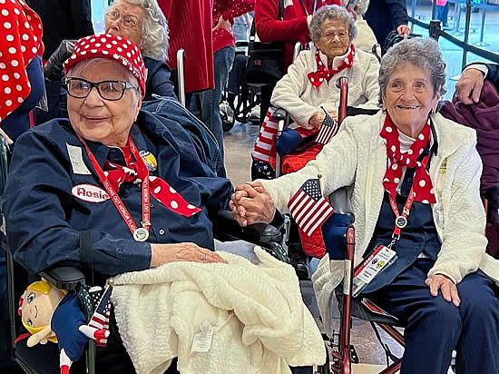 The group of eleven Rosies all wore the signature red polka-dot clothing that has become synonymous with Rosie the Riveter. (Boeing photo)