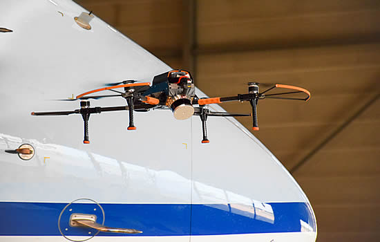 The drones fly in a set grid over the plane’s surface - taking up to 1,000 high definition photos.