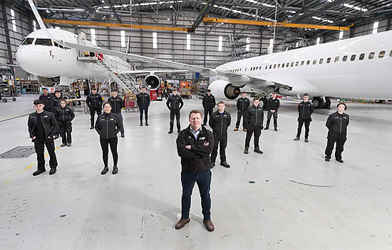 AAG CEO Shane O’Neill pictured with a group of apprentice aircraft mechanics at AAG headquarters in Shannon.