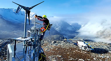A technician maintains a remote mountaintop weather camera site in Alaska. This is one of 299 FAA weather cameras across the United States that help pilots be aware of conditions in near-real time so they can fly more safely. (Photo: FAA).