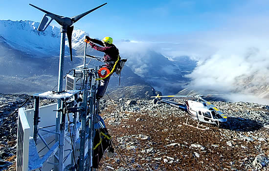 A technician maintains a remote mountaintop weather camera site in Alaska. This is one of 299 FAA weather cameras across the United States that help pilots be aware of conditions in near-real time so they can fly more safely | Photo: FAA.