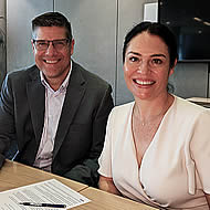 Medaire CEO Bill Dolny, with Elmarie Marais, CEO of GoCrisis.